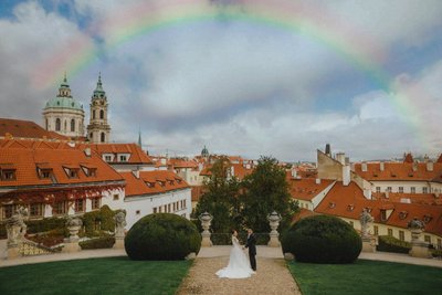 Prague Vrtba garden wedding photo rainbow above newlyweds