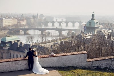 newlyweds enjoy stunning vista of misty Prague