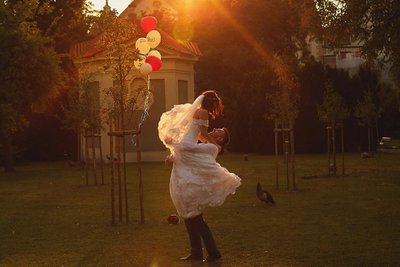 Bride & Groom silhouetted against the sun in Prague's Secret Garden