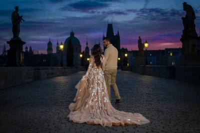 Walking hand-in-hand Charles Bridge  