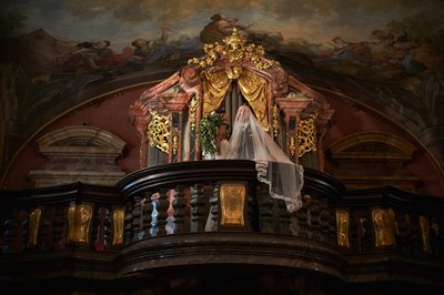 Bride covers groom Mirror Chapel