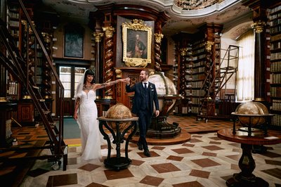 Newlyweds exploring Klementinum Baroque Library 