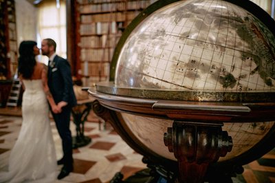 Antique globe and kissing newlyweds.