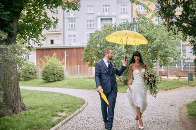 Newlyweds in the rain