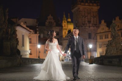 Walking across Charles Bridge before sunrise