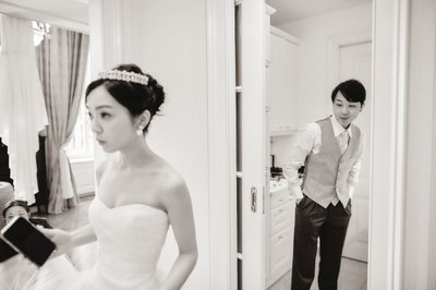 groom peeking at bride