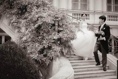 Bride escorted down stairs Palais Coburg