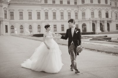 newlyweds walking through garden