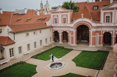 Prague newlyweds walking through Ledebour Garden