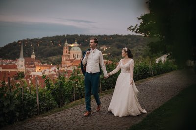 Newlyweds enjoy the view overlooking Prague at dusk