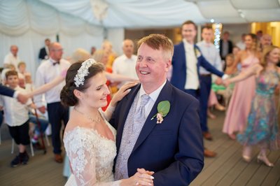 The beaming father and daughter first dance