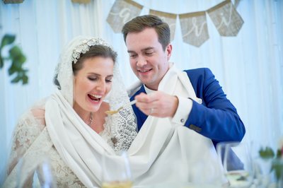 Newlyweds take turns feeding each other soup