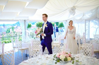 smiling bride and groom arrive at the Villa Richter