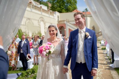 Smiling Bride And Her Groom At The Ledebour Garden