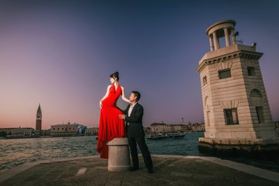 Thai Woman In red dress posing for her man in Venice