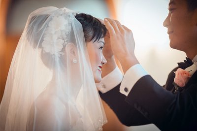 Lovingly Adjusting Bride's Veil Castle Hluboka Wedding