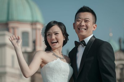 Radiant Hong Kong Newlyweds Waving to admirers in Prague