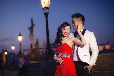 Woman embracing her Hong Kong man atop Charles Bridge