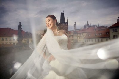 Radiant Bride Posing Atop Charles Bridge At Dawn