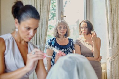 Bride's Mother and Aunt watching preparation