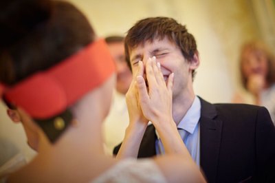 blindfolded bride struggles to find groom