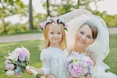 bride and flower girl with their bouquets