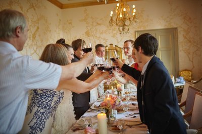 toasting the newlyweds with wine