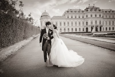 Newlyweds Kiss at the Belvedere Palace in Vienna