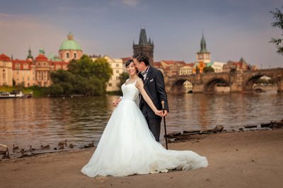 Iconic Riverside and Charles Bridge Couples Photo
