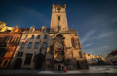 Elegant Couple Walking Under Orloj