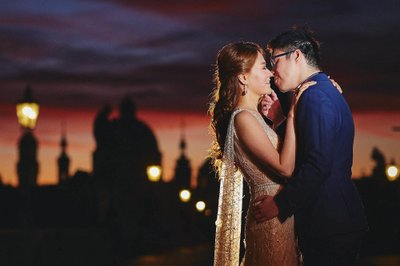 Elegant couple embracing at sunrise Charles Bridge