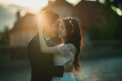 Sun-Flared Embrace atop the Charles Bridge