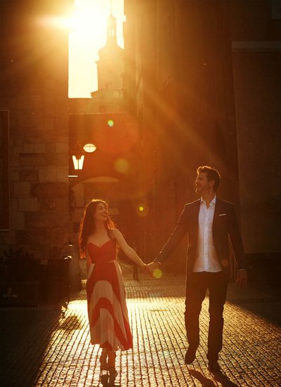 gorgeous Italians walking in sunlight in the old town