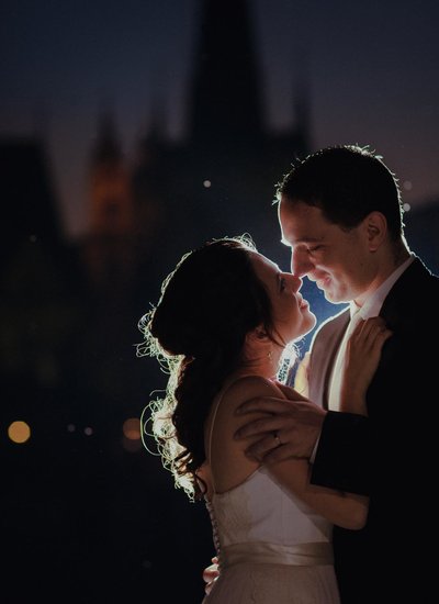 Romantic kiss bride & groom Charles Bridge