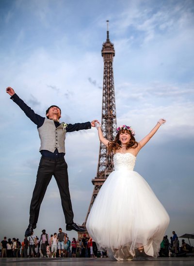 Newlyweds doing it their way at Eiffel Tower