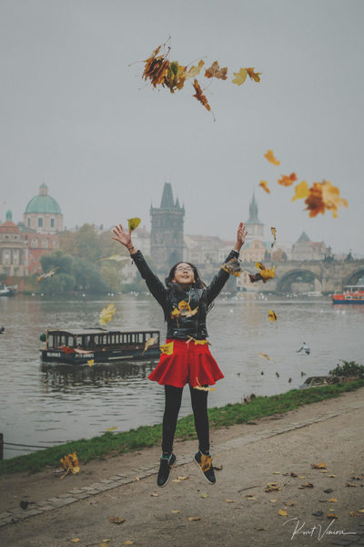 Jumping for joy with the Autumn leaves Charles Bridge
