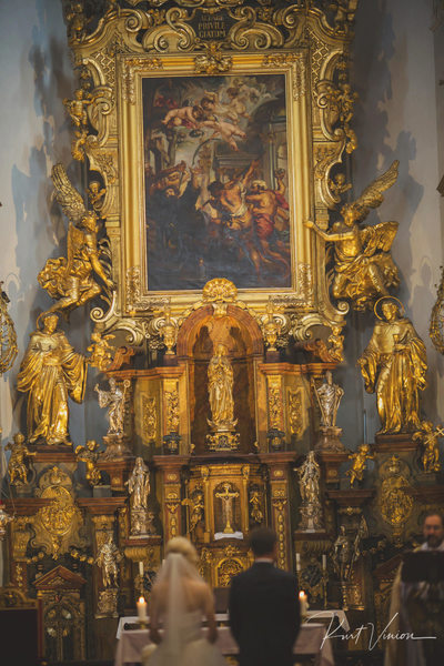 bride & groom under the altar 