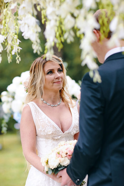 The beautiful Bride Anna listens to Sergio's vows