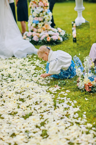 girl picking through the roses