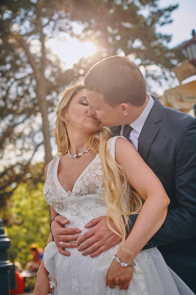 beaming bride kisses her groom