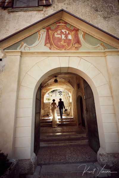T+S enter Bled Castle on wedding day