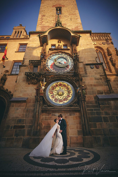 Bride in Berta dress underneath Astronomical Clock