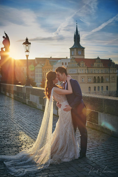 the sun flared kiss atop Charles Bridge