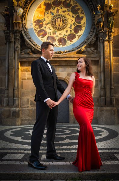 elegant woman in red under Orloj