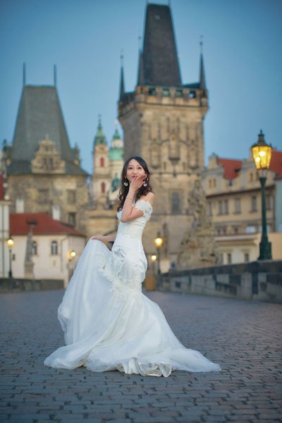 blowing kisses atop Charles Bridge