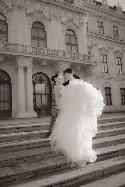 Picking up his bride in front of Belvedere