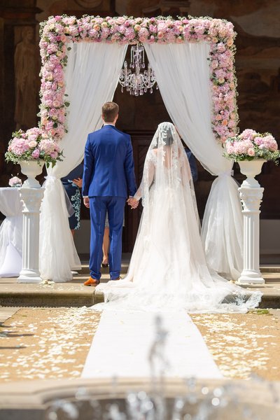 Bride & Groom Under The Floral Arch Ledebour Garden Wedding Prague