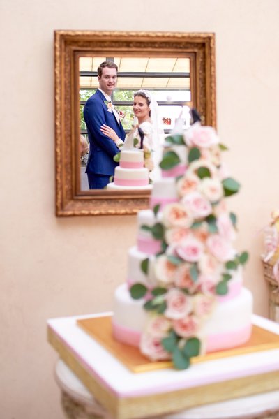 Bride & groom pictured near the wedding cake