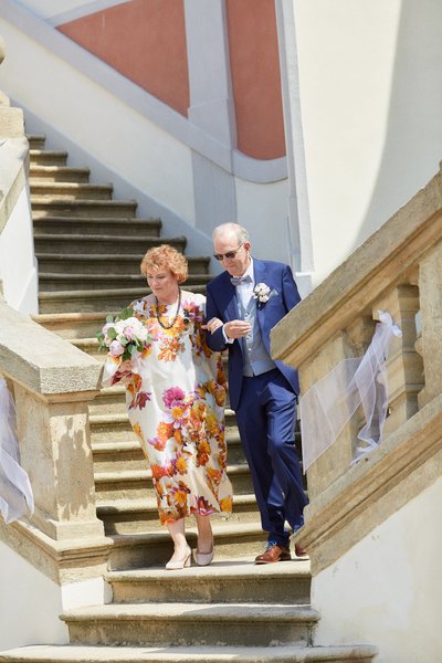 The groom's father escorts the bride's mother to the Ledebour Garden