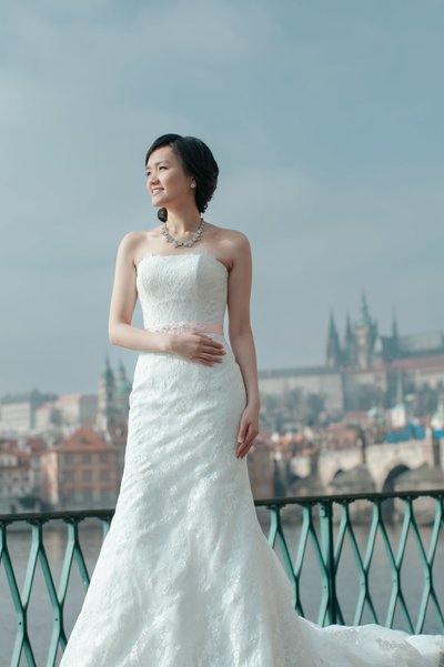 Elegant Hong Kong Bride posing near Prague Riverside